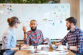 Multiethnic group of young people sitting in conference room and brainstorming on business meeting .jpeg